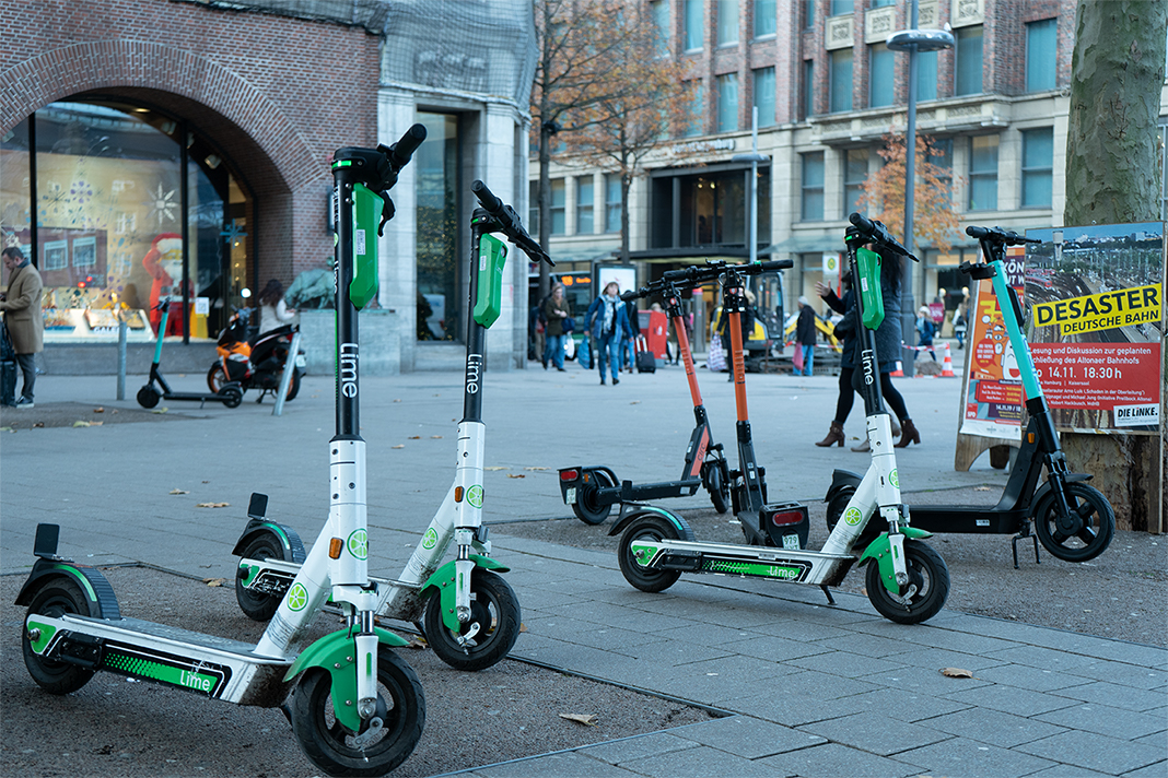 E-scooters parked on the pavement