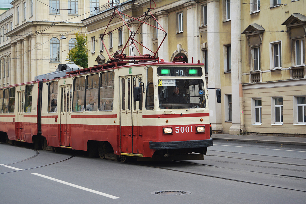 A tram is riding on the streets of Saint Petersburg.