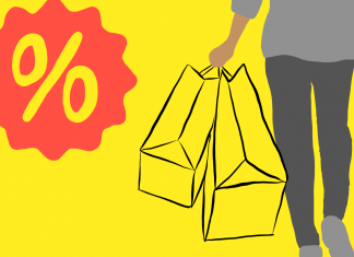 Black Friday: Verdammt ich lieb’ dich Eine Person hält Tüten voller Sonderangebote und Deals am Black Friday.