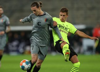 DFB-Pokal: Hamburger Teams ziehen ins Viertelfinale ein St. Paulis Jackson Irvine (links) und Dortmunds Thorgan Hazard kämpfen um den Ball. Hamburg DFB-Pokal