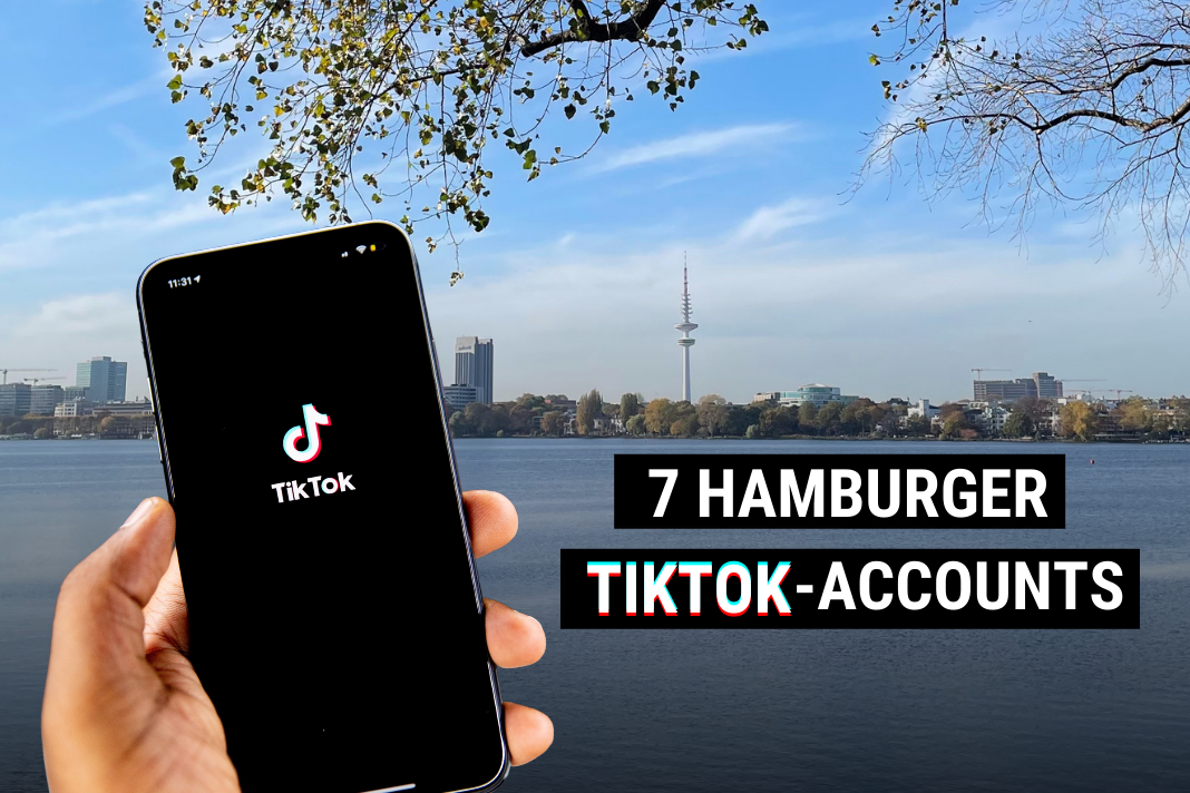 Handy in der Hand mit TikTok App und Hamburger Skyline im Hintergrund