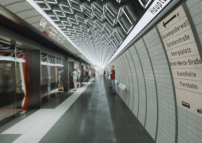 Entwurf der neuen U5-Haltestelle Der Entwurf der Haltestelle zeigt eine U-Bahn Haltestelle mit gekachelten Wänden und Lichtelementen an der Decke und wartenden Menschen.