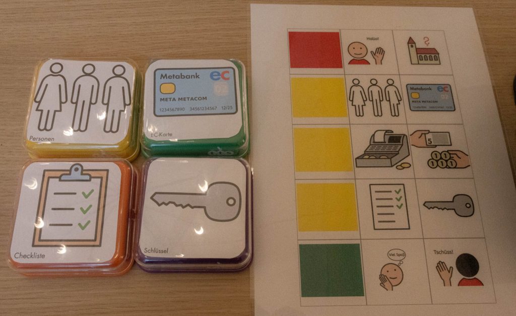 Verschiedenfarbige Buzzer liegen neben einer entsprechenden Anleitung.